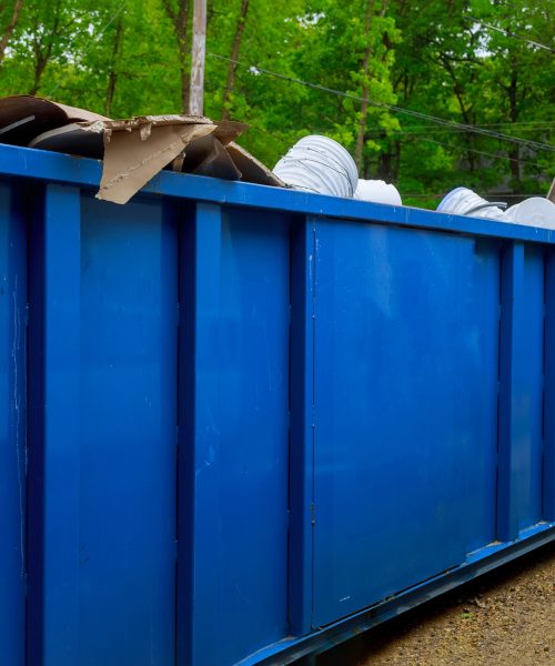 Truck loading a full recycling container trash dumpsters being with garbage container trash